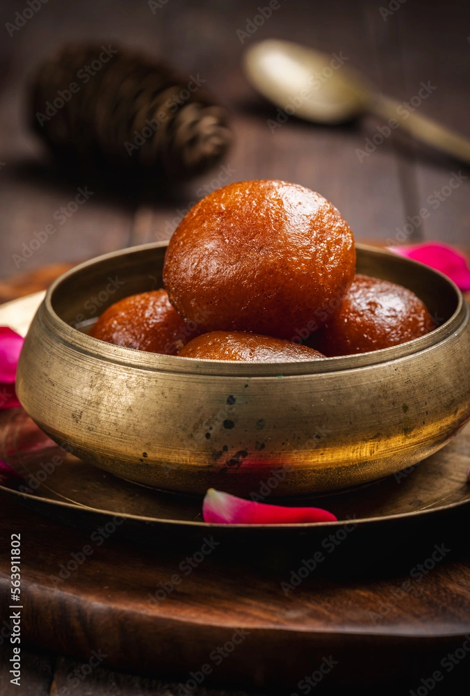 Gulab Jamun - Soft milk dumplings in rose syrup